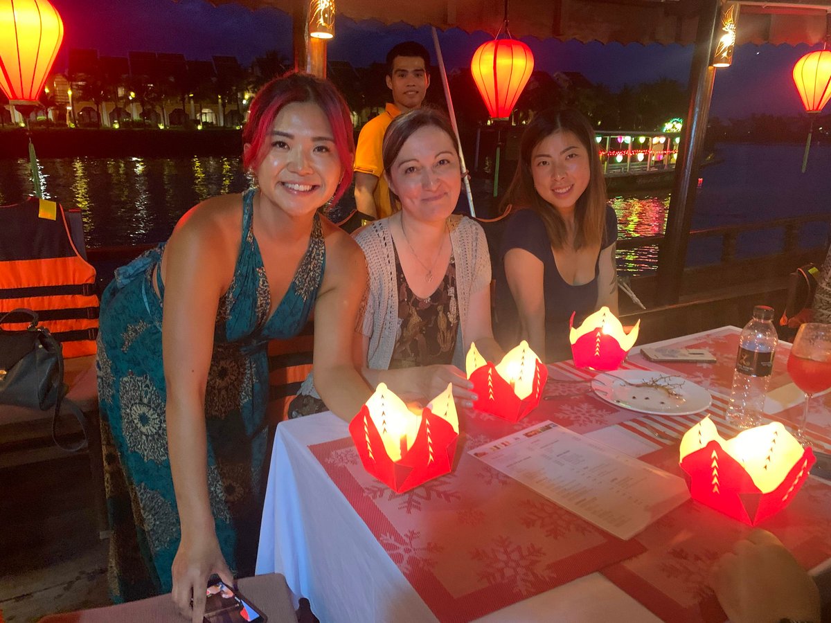 TrovaTrip Host and Travelers making lanterns in Vietnam.
