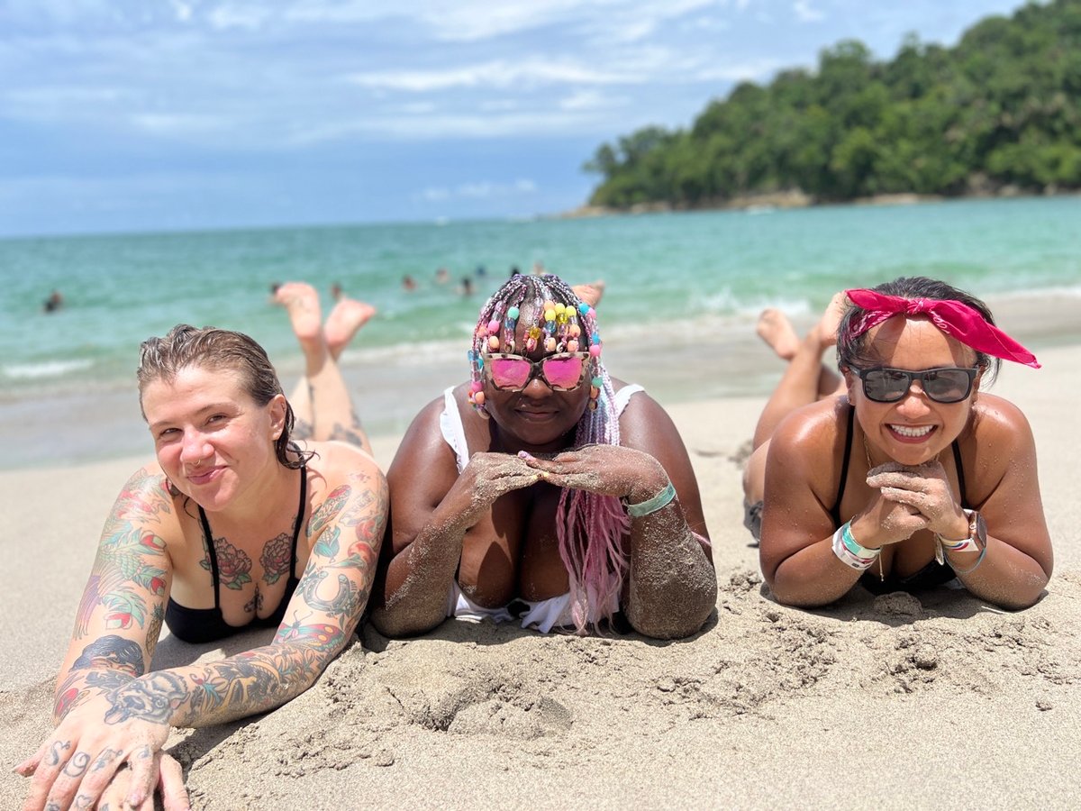 Friends laying on the beach in Costa Rica.