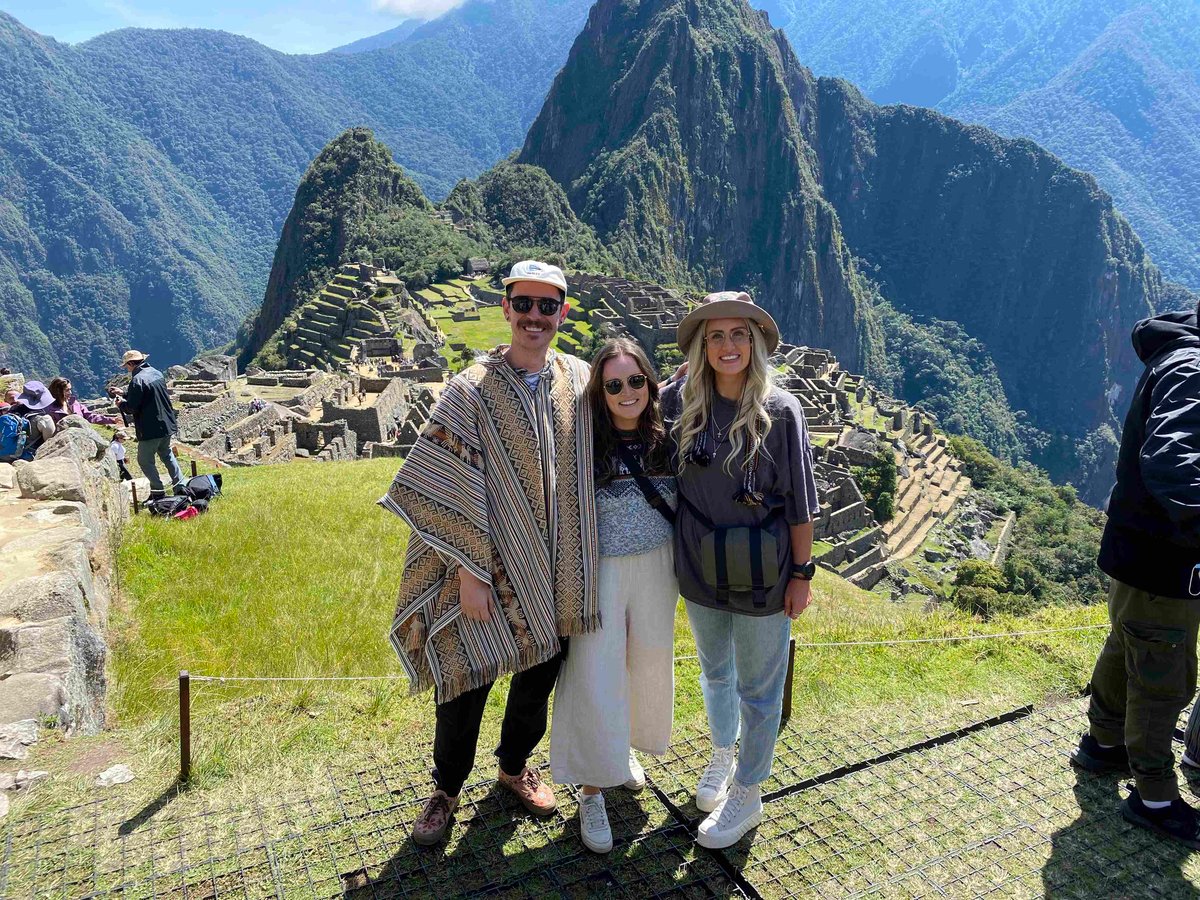 TrovaTrip Hosts and Traveler at Machu Picchu, Peru.